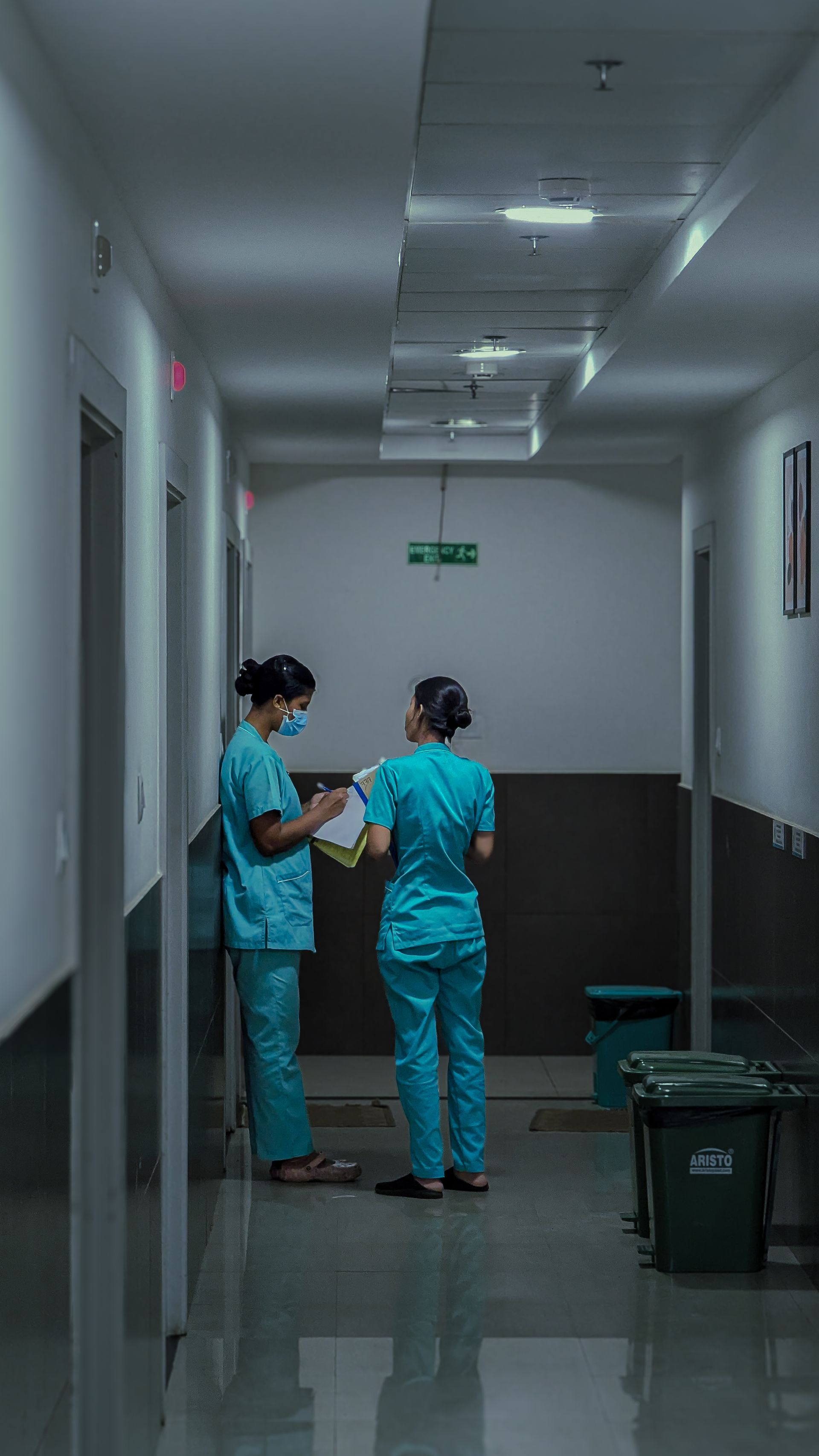 Healthcare professionals in a hospital corridor